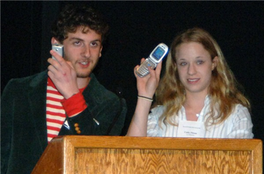 Max Freedman and Cathy Pitoun ask the audience to silence their cell phones.